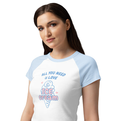 Woman wearing a white and light blue t-shirt with an ice cream cone graphic and text.