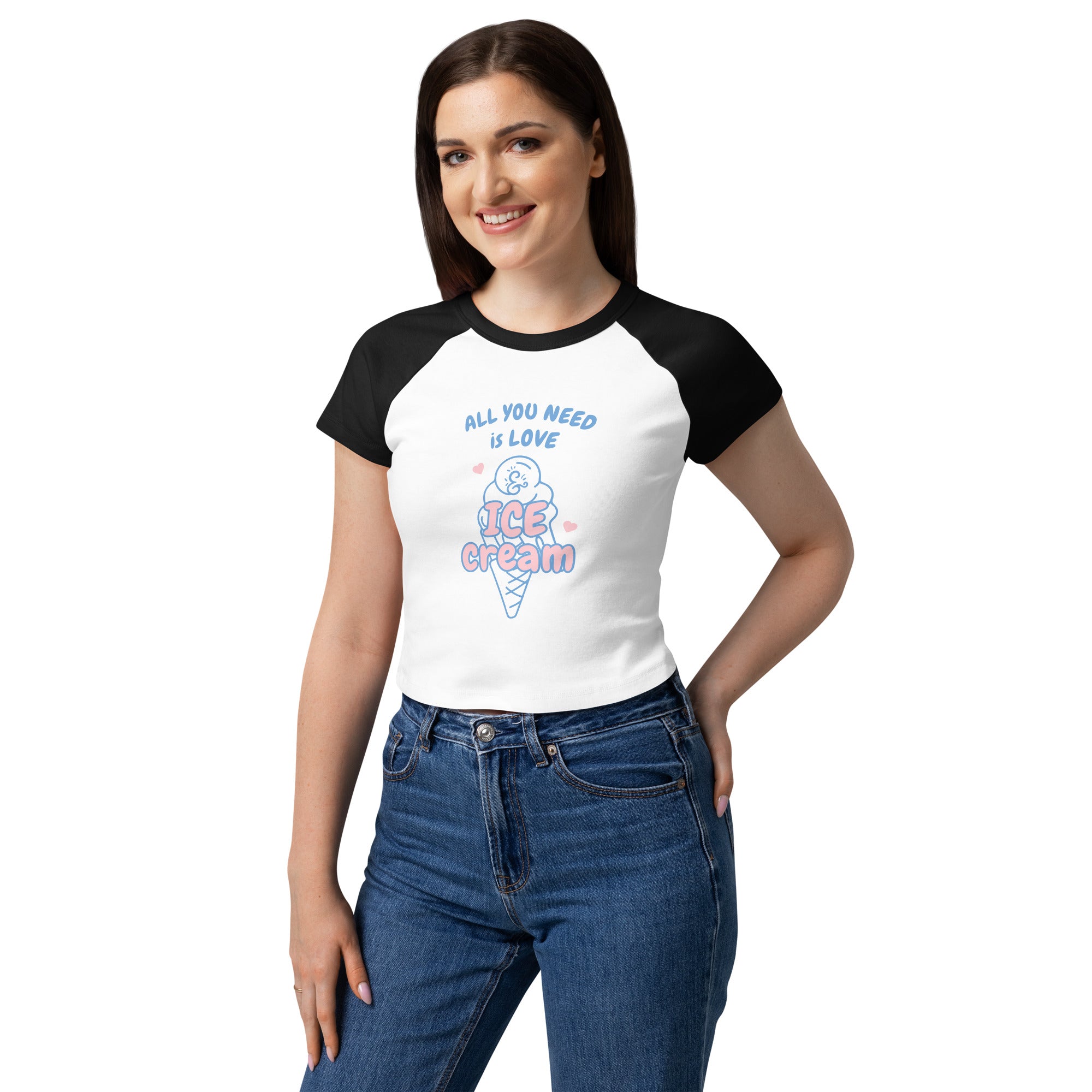 Woman wearing a white and black baseball shirt with ice cream graphic and text.