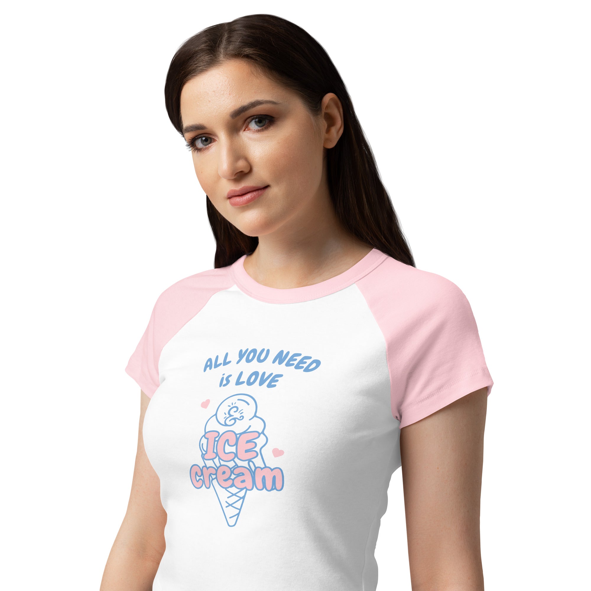 Woman wearing a white and pink t-shirt with an ice cream cone graphic and text.