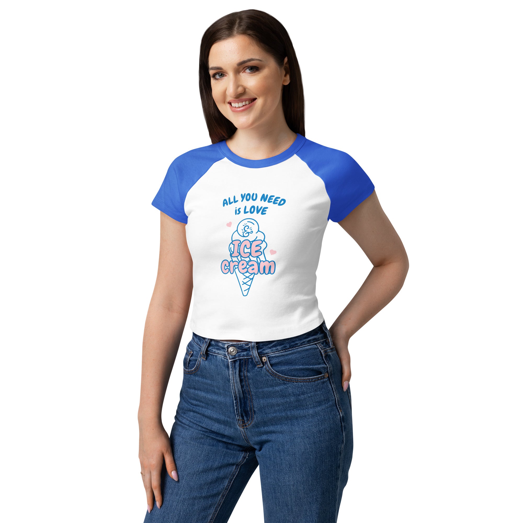 Woman wearing a white t-shirt with blue sleeves and ice cream cone graphic, on a white background